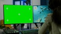 Black woman gamer streaming with chroma key display