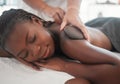 Black woman gets hot stone massage, spa and hands of masseuse, holistic and wellness physical therapy. Health, peace Royalty Free Stock Photo