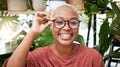 Black woman, glasses and vision with smile in portrait, eye care and optometry with frame and prescription lens