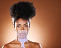 Black woman, hair care beauty or model with afro comb in brown studio background portrait. Health salon, wellness or