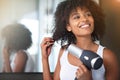 Black woman, hairdryer and hair with beauty and texture, curly hairstyle or frizz with morning routine in bathroom Royalty Free Stock Photo