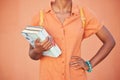 Black woman, hands and text books for education, learning or classroom study in orange background in studio, school or Royalty Free Stock Photo