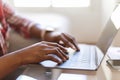 Black woman hands typing on pc laptop keyboard, cropped Royalty Free Stock Photo