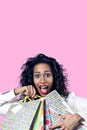 Black woman happy with perfect shopping paper bags, opened mouth Royalty Free Stock Photo