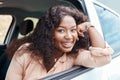 Black woman, happy and smile at window of car on road trip, travel or vacation. Portrait, woman and driver with