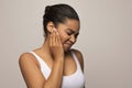 Black woman having ear pain, touching her painful head Royalty Free Stock Photo