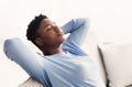 Black woman having rest at home on the sofa Royalty Free Stock Photo