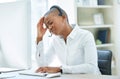 Black woman, headache and stress in call center by computer for consulting in customer service at the office. African Royalty Free Stock Photo