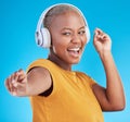 Black woman, headphones and dance, listen to music and energy with happiness isolated on blue background. Female person