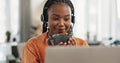 Black woman, headset and coffee in home office with laptop and remote work and break in apartment. Virtual assistant at