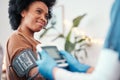 Black woman, healthcare and blood pressure machine in checkup with caregiver for monitoring pulse at home. Happy African