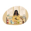 Black woman holding bottle of chosen bodycare product in cosmetics store