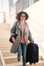Black woman holding luggage ready for travel Royalty Free Stock Photo