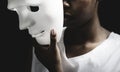 Black woman holding white mask Royalty Free Stock Photo