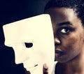 Black woman holding a white mask Royalty Free Stock Photo