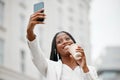 Black woman, lawyer with coffee and selfie on coffee break in New York outside law firm building, smile with smartphone