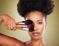 Black woman, makeup brush and beauty in studio for skincare portrait, wellness and cosmetics by backdrop. African woman Royalty Free Stock Photo