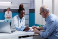 Black woman with medic profession looking at documents Royalty Free Stock Photo