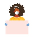 A black woman in a medical mask and gloves holds a poster with place for text. Template for design, coronavirus epidemic