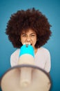 Black woman megaphone, blue background and shouting news for advertising or marketing a retail startup campaign launch