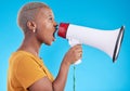 Black woman, megaphone and shout in studio, protest and profile with noise for human rights by blue background. African