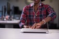 Black woman in modern office at her workplace speeking on phone Royalty Free Stock Photo