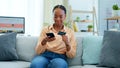 Black woman, phone and credit card on sofa for payment, online shopping or fintech at home. Happy African female person Royalty Free Stock Photo