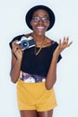 Black woman, photographer and portrait in studio with happiness, creativity and camera for talent and creative artist