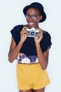 Black woman, photographer and portrait in studio with smile, creativity and camera for talent and creative artist career