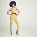 Black woman, portrait and retro fashion in studio for vintage, unique look and jumpsuit. African girl, stylish and gen x Royalty Free Stock Photo