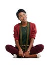 Black woman, portrait or sitting on isolated white background in trendy, cool or stylish clothes. Smile, happy or