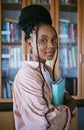 Black woman portrait, university student and library campus for learning, studying and college education in Brazil