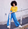 Black woman, portrait and urban fashion in the city for stylish or colorful clothing with afro hair style. African Royalty Free Stock Photo