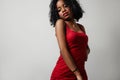 Black woman in red evening slim dress