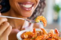 Black woman relishes boiled prawns at home