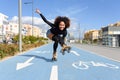 Black woman on roller skates riding on bike line Royalty Free Stock Photo