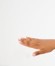 Black Woman`s hand with palm down. handbreadth on a white background. Front view. Mock up. Copy space. Template. Blank.