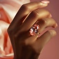Black woman\'s hand with pink gemstone ring. AI generated Royalty Free Stock Photo