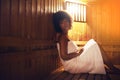 Black woman, sauna and detox at spa for healing, self care with wellness and zen. Relax, calm and peace on pamper day Royalty Free Stock Photo
