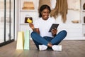 Black Woman Shopping Online With Tablet And Credit Card Indoor