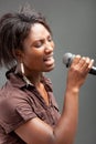 Black Woman Singing Into Microphone Royalty Free Stock Photo