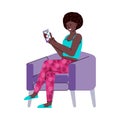 Black woman sitting on chair using phone app with chat messenger. Royalty Free Stock Photo