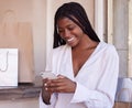 Black woman, smartphone and shopping, happy and communication, retail and sale with bargain, discount with technology Royalty Free Stock Photo