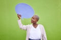 Black woman, speech bubble and thinking for mockup space, smile and opinion by green wall background. African girl