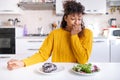 Black woman starting new diet choosing healthy food