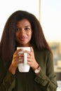 A black woman student in an office holds Royalty Free Stock Photo