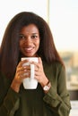 A black woman student in an office holds Royalty Free Stock Photo