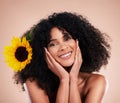 Black woman, studio portrait and sunflower with skincare, beauty or cosmetic wellness by beige background. African gen z Royalty Free Stock Photo