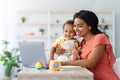 Black Woman Study With Laptop At Home And Taking Care About Child Royalty Free Stock Photo