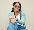 Black woman, sunglasses and portrait by wall background in city with fashion, summer and beauty. Young gen z, african Royalty Free Stock Photo